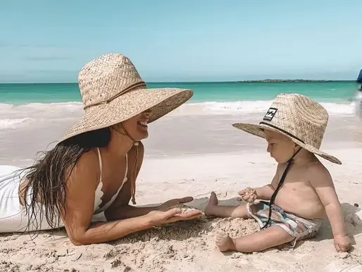 Guest hangs lightly in anti-gravity yoga pose — within a favored beachfront hotel that celebrates soulful movement and ocean breezes.