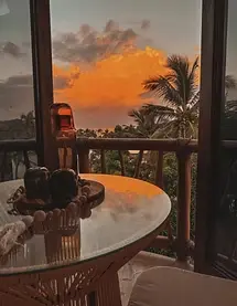 Deluxe Suite 1 glows with sunset light and hand-built hardwoods — a north-end wellness escape within Amari’s boutique hotel.