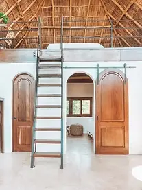 A vaulted palapa suite designed for elevated living and Pacific calm — showcasing Amari’s signature hand-tooled design