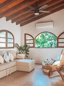 Villa Ama opens to a vaulted living space with hand-built touches — a family retreat amid Pacific Riviera’s boutique hotels.