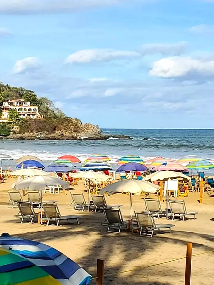 Bright umbrellas color Sayulita’s main beach as families gather to swim and relax, soaking in the rhythm and sun-washed beauty of Mexico’s Pacific Coast.