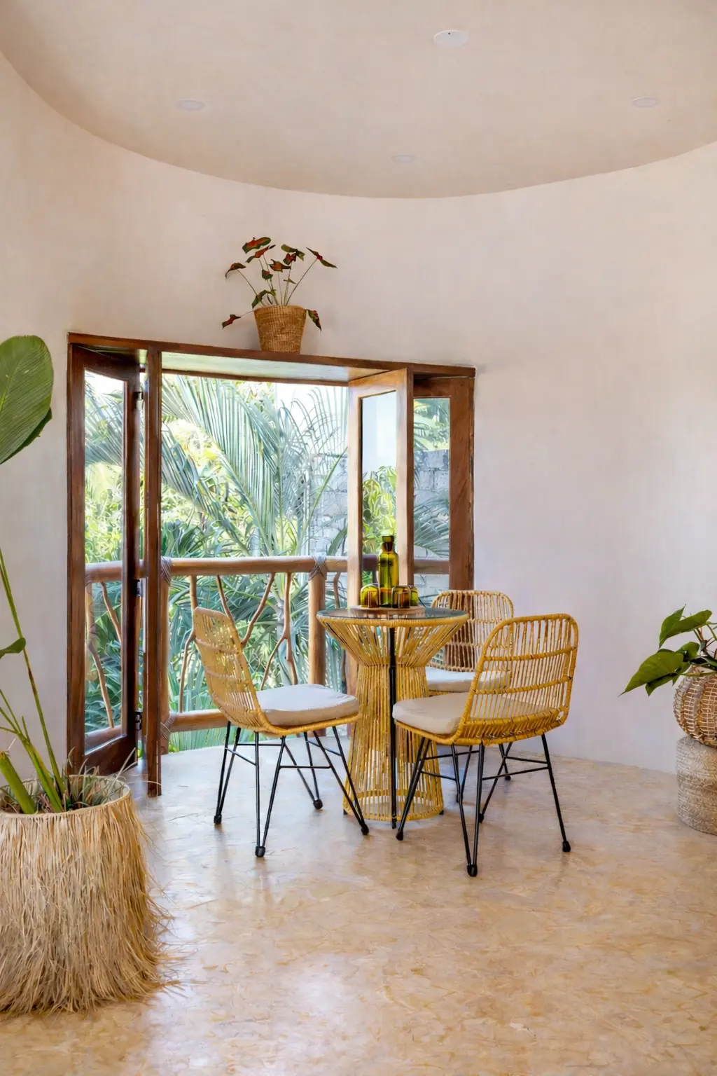 Indoor-Outdoor Dining Area With Open Terrace Doors and Tropical Views
