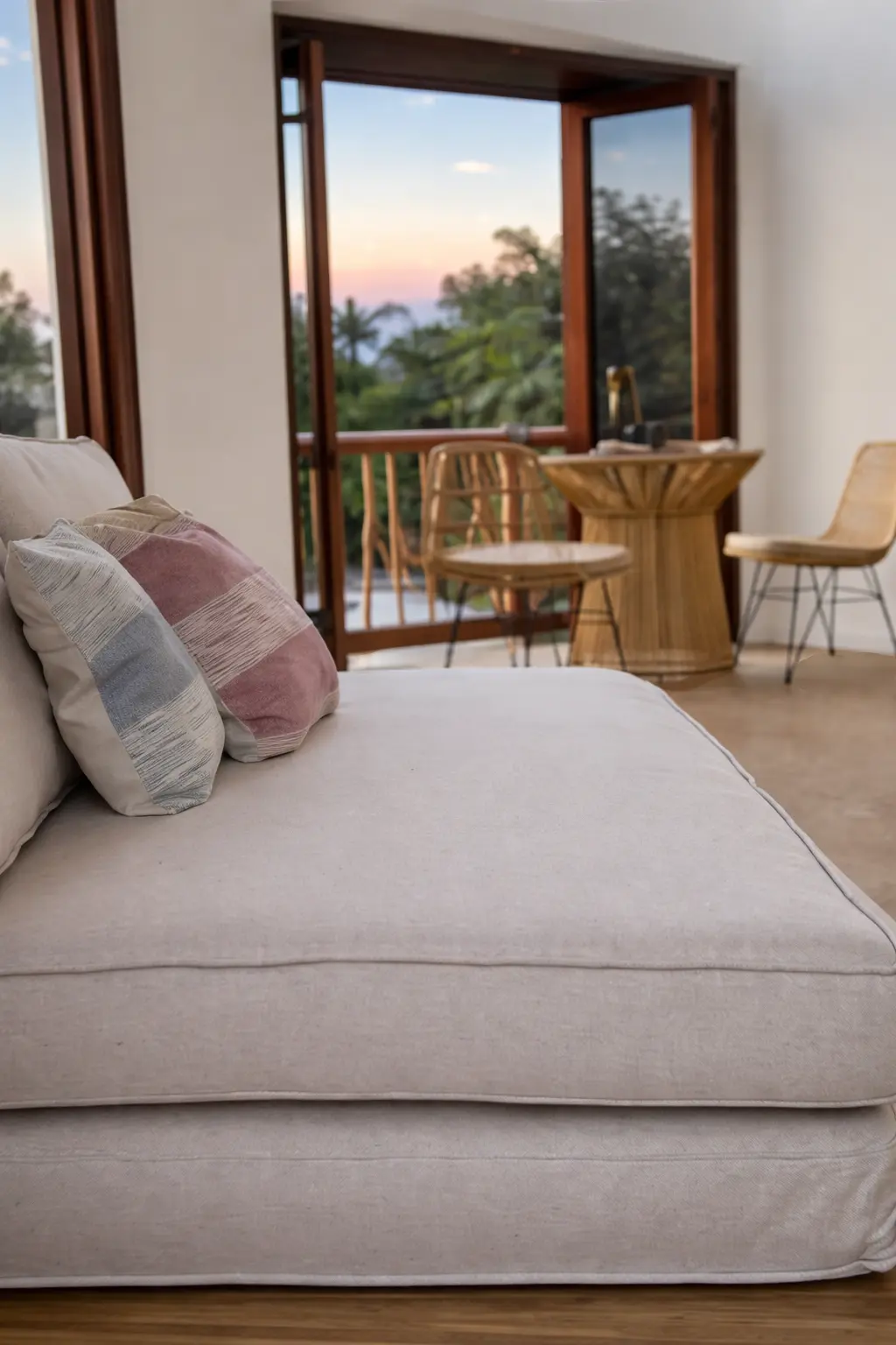 Lounge Seating With Open Terrace Doors and Sunset Ocean View