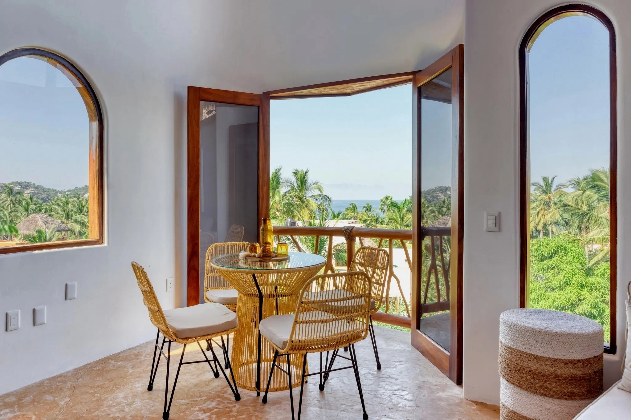 Dining Table With Open Terrace Doors, Palm Views, and Ocean Peek