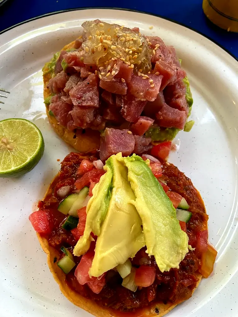 Tuna and avocado tostadas paired with mezcal capture El Jakal’s easy coastal vibe along Nayarit’s western Riviera.