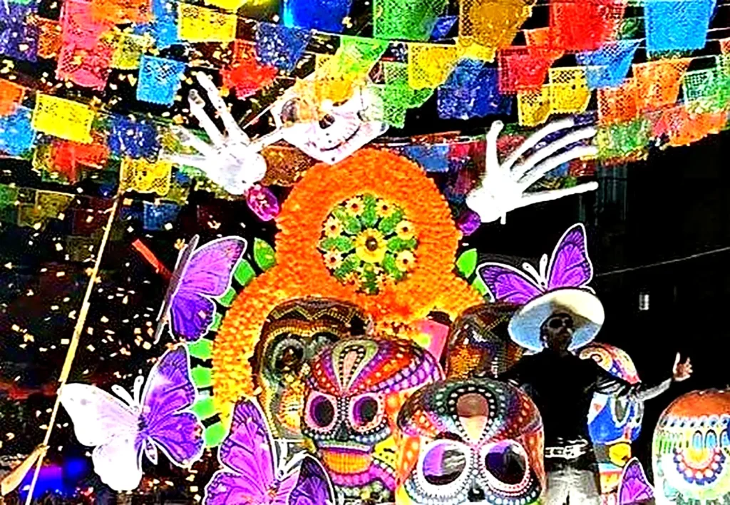 Fiesta night shines with papel picado banners, while colorful Día de los Muertos skull decorations glow in the background.