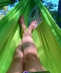 Guest lounges in a woven hammock amid tropical greenery — a discreet Amari retreat and premier hotel on the Pacific Riviera.