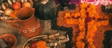 Families craft glowing ofrendas with candles and marigolds, celebrating remembrance in a heartfelt moment embraced by the best hotel in Sayulita.