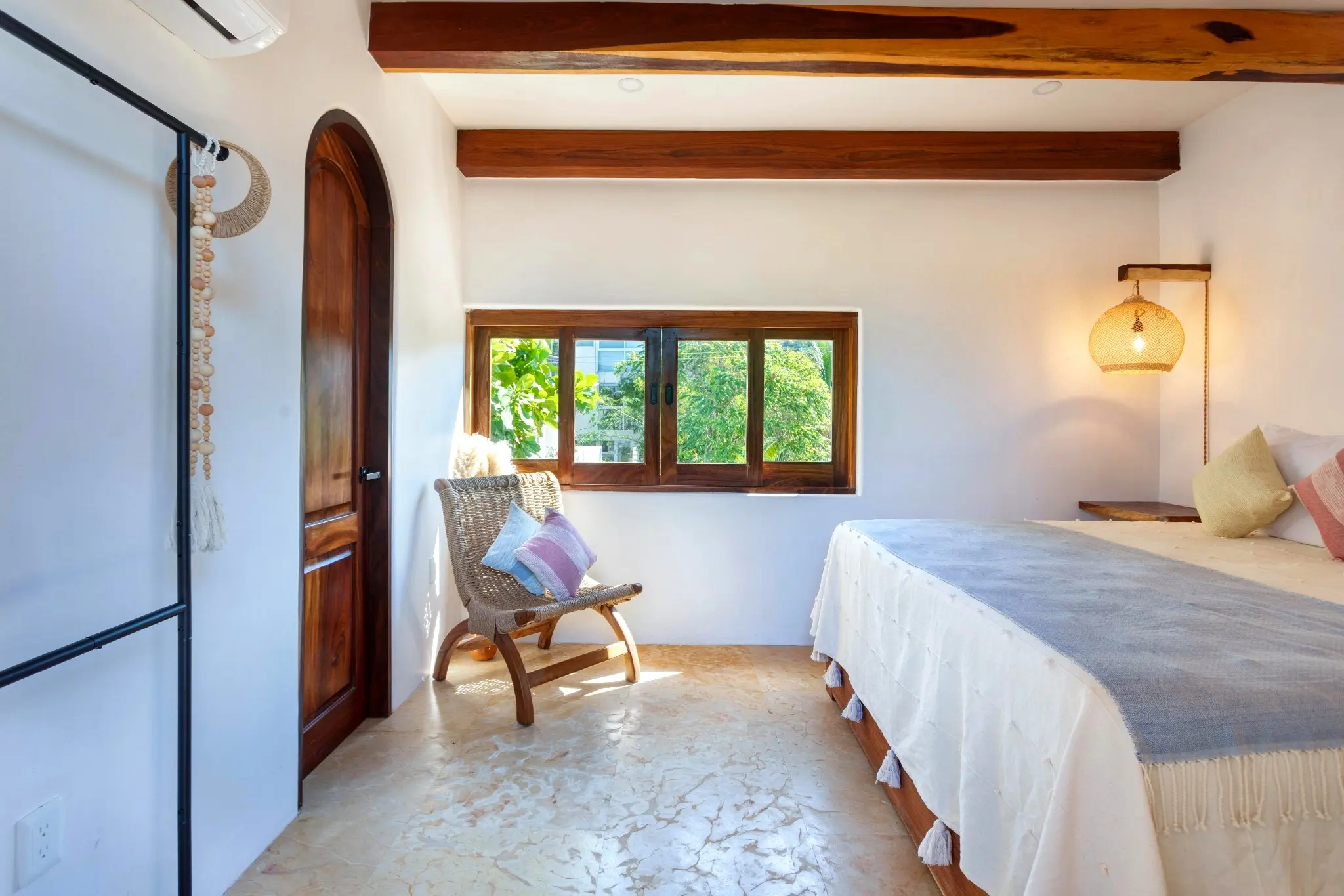 Lounge Corner With Arched Wood Details and Tree-Top Views