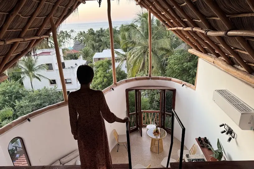 Rooftop Staircase Landing With Sunset Light and Coastal Views