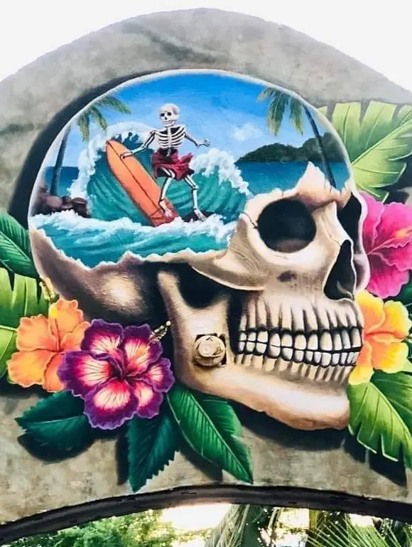 A colorful mural of a skeleton surfing inside a skull highlights playful artistry and seaside spirit found along Mexico’s Nayarit Coast.