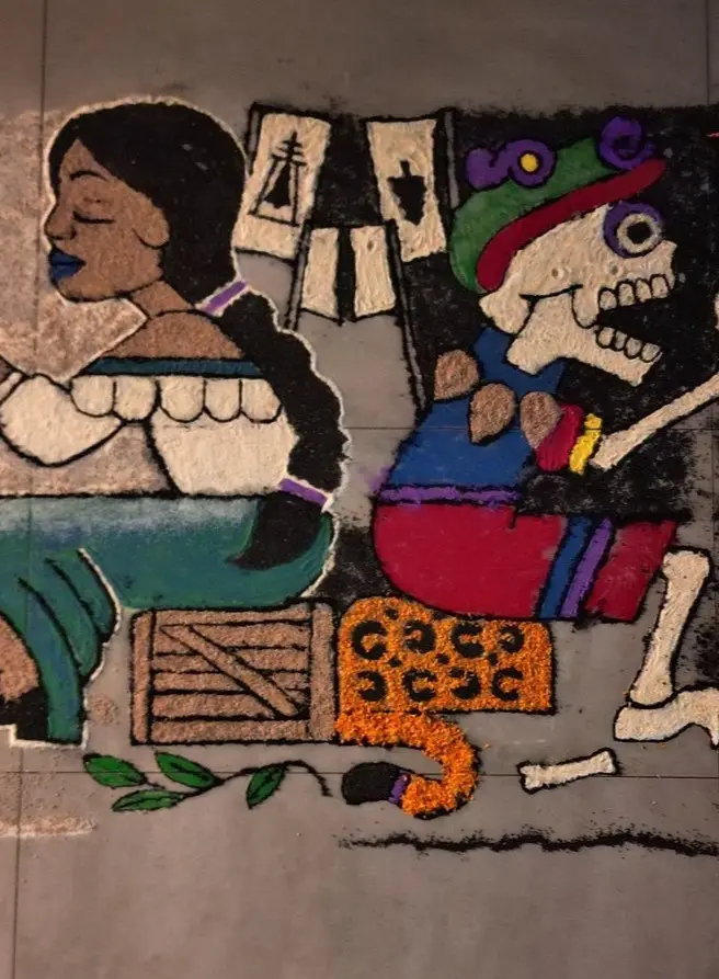 A vivid tapete de arena made with sand and marigold petals depicts life’s transience—Día de Muertos art in the Riviera Nayarit Stretch of coast.