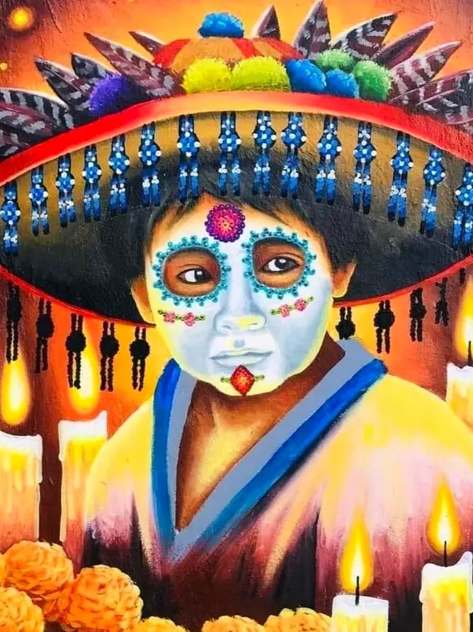 Día de los Muertos mural shows a child with a sugar skull face and wide sombrero, surrounded by candles and marigolds along the Jalisco–Nayarit coast.