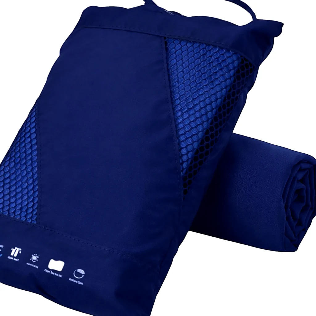 Compact quick-dry travel towel packed in a mesh pouch, a practical add-on for beach days on the West Coast of Mexico (Nayarit).