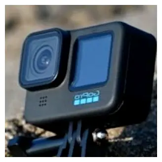 Compact action camera resting outdoors, a great add-on for filming surf sessions and beach days in Sayulita.