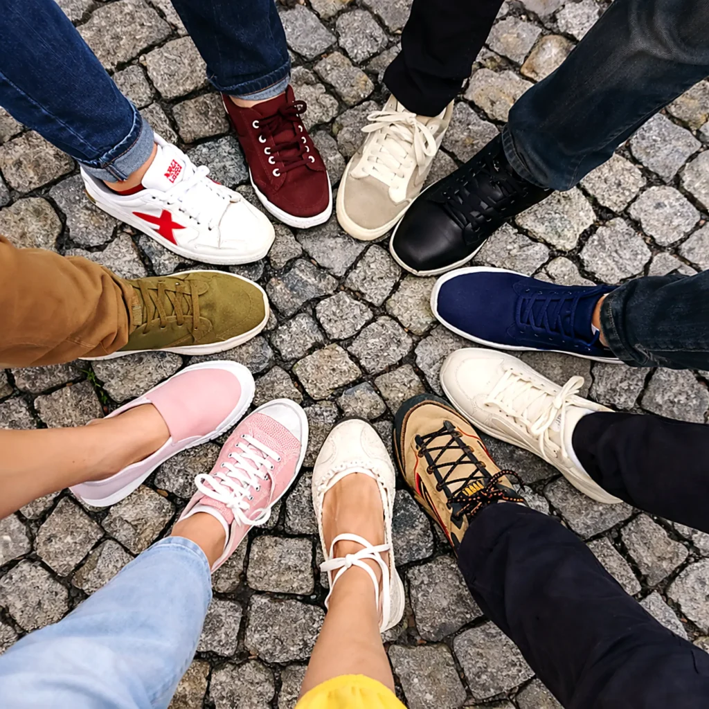 Variety of comfortable shoes in a circle on cobblestone streets, a smart packing pick for walking around town.