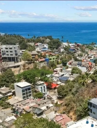 Elevated view from Gringo Hill overlooking the South Side, residential neighborhoods, and the Pacific coastline.