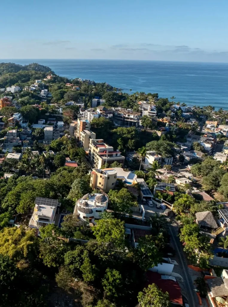 Elevated panorama overlooking the South Side, tropical hillsides, and the Pacific coastline.