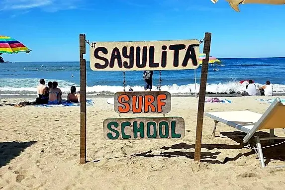 surf-school-sign-sand-nayarit-amari.webp
